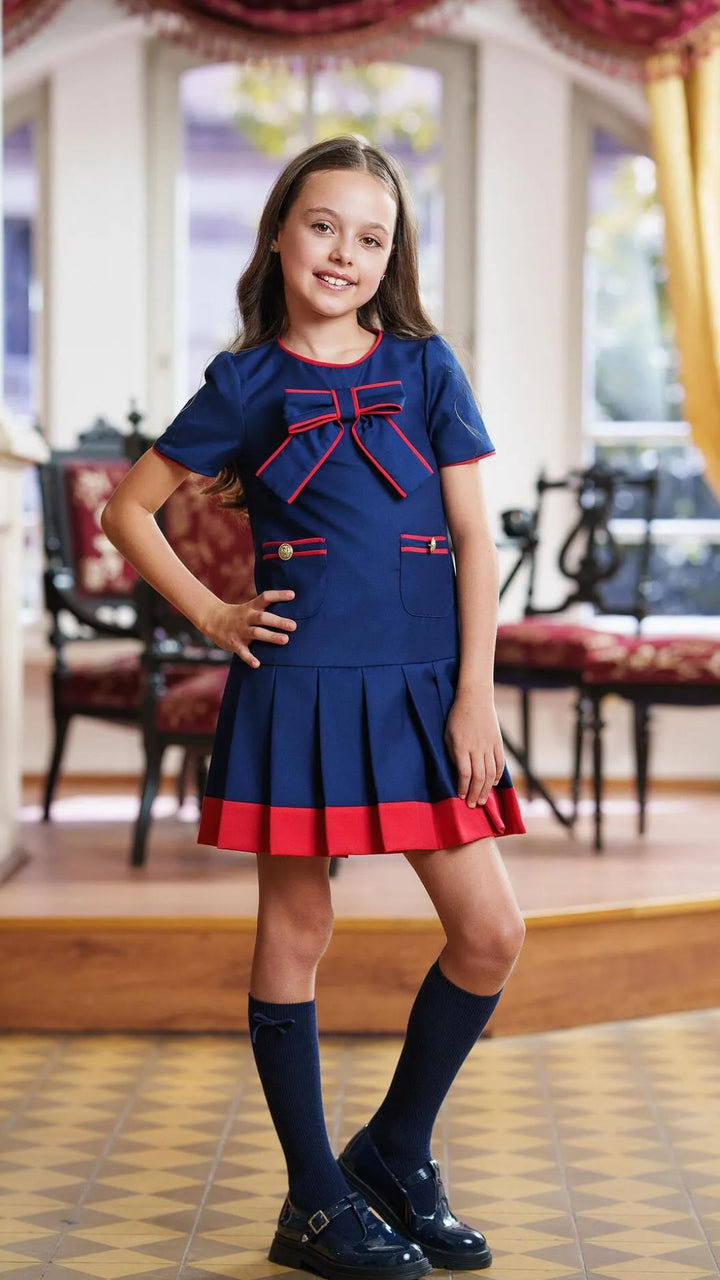 Girls’ Navy Blue Pleated Dress with Red Trim & Bow