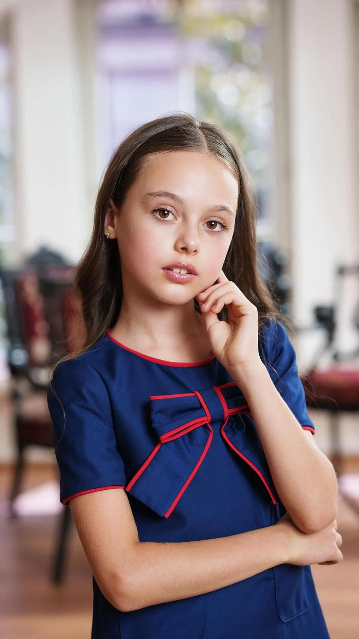 Girls’ Navy Blue Pleated Dress with Red Trim & Bow