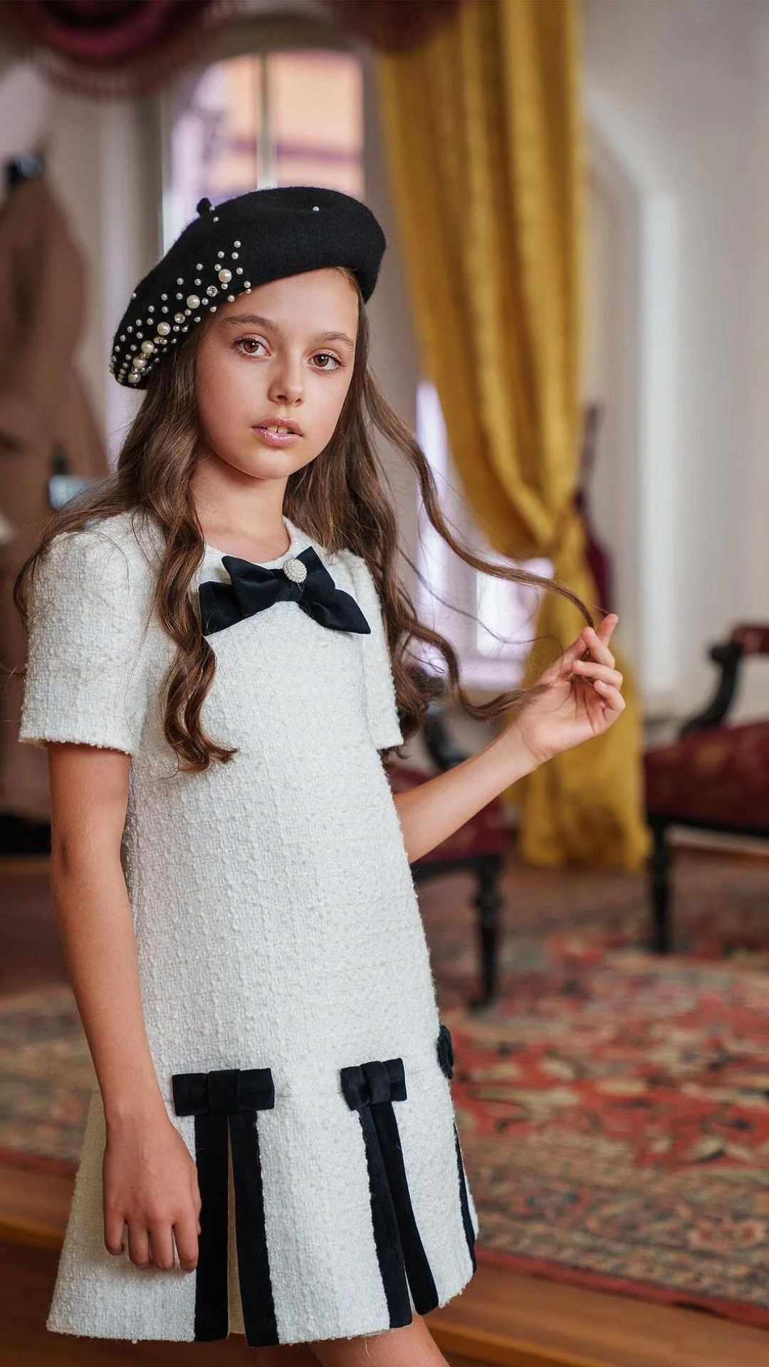 Girls’ White Bouclé Dress with Black Velvet Bows & Pearl Detail